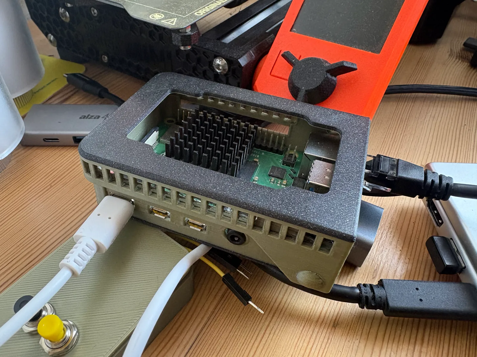 The Raspberry Pi 4 running the demo, in a 3D-printed case on a desk
